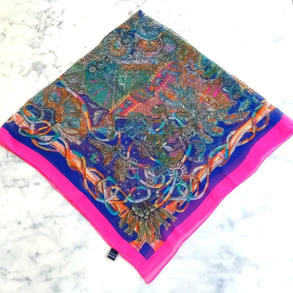 NWOT. 100% Silk Scarf with multi color patterns.